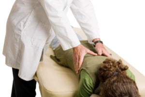Patient receiving benefits of Justin chiropractic.