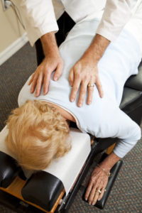 woman on table for chiropractic adjustment